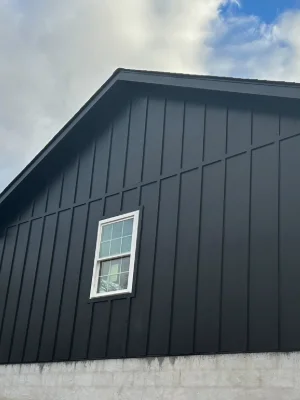 A building receiving new siding by Cabrera Built